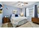 Comfortable bedroom featuring cozy decor, soft lighting, and ample natural light from a window at 15501 E 112Th Ave # 20C, Commerce City, CO 80022