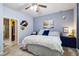 Bright bedroom with plush bedding, soft lighting, and a glimpse into a walk-in closet at 15501 E 112Th Ave # 20C, Commerce City, CO 80022