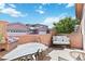 Cozy patio with outdoor seating, privacy walls, and view of neighboring properties at 15501 E 112Th Ave # 20C, Commerce City, CO 80022