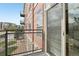 Cozy balcony with neighborhood views, accessed through a sliding glass door for easy outdoor enjoyment at 13456 Via Varra # 211, Broomfield, CO 80020
