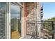 Private balcony featuring stone accents and a sliding glass door for seamless indoor-outdoor living at 13456 Via Varra # 211, Broomfield, CO 80020