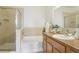 Bathroom featuring a tub/shower combo with glass door and a vanity with sink at 13456 Via Varra # 211, Broomfield, CO 80020