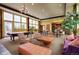 Inviting clubhouse with comfortable furnishings, a pool table, and a convenient kitchen area at 13456 Via Varra # 211, Broomfield, CO 80020