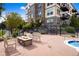 Outdoor stone firepit with community BBQ at 13456 Via Varra # 211, Broomfield, CO 80020