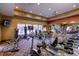 Well-equipped gym with cardio machines, free weights, and mounted TVs for a complete workout experience at 13456 Via Varra # 211, Broomfield, CO 80020