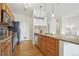 Contemporary kitchen with stainless steel appliances, wooden cabinets, and a spacious granite countertop at 13456 Via Varra # 211, Broomfield, CO 80020