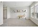 Bright living room with carpet, a desk, chair and natural light from the windows at 13456 Via Varra # 211, Broomfield, CO 80020