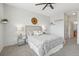 Serene main bedroom with a ceiling fan, soft lighting, and minimalist design at 13456 Via Varra # 211, Broomfield, CO 80020