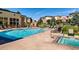 Community pool with tanning area and outdoor fireplace at 13456 Via Varra # 211, Broomfield, CO 80020