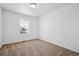 Bright bedroom with neutral carpet, white walls, and a window for natural light at 3360 N Coolidge Way Way, Aurora, CO 80019