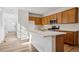 Modern kitchen features stainless appliances, a kitchen island with ample counter space and a sink at 3360 N Coolidge Way Way, Aurora, CO 80019