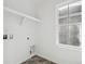 Laundry room with tiled floor, window, shelf and washer/dryer hookups at 3360 N Coolidge Way Way, Aurora, CO 80019