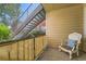 Relaxing balcony with chair, privacy screen, and a view of stairs leading down at 13704 E Lehigh Ave # D, Aurora, CO 80014