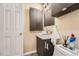 A stylish bathroom features a modern vanity and fixtures, offering a fresh and functional space at 13704 E Lehigh Ave # D, Aurora, CO 80014
