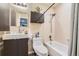 Bathroom features modern sink and vanity, toilet, and shower-tub combination at 13704 E Lehigh Ave # D, Aurora, CO 80014