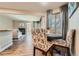 Dining area with table for four with access to living room with fireplace and open floor plan at 13704 E Lehigh Ave # D, Aurora, CO 80014