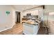 Stylish kitchen with stainless steel appliances, granite countertops, and a stone backsplash at 13704 E Lehigh Ave # D, Aurora, CO 80014