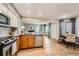 Updated kitchen featuring granite countertops, stainless steel appliances and sleek design, open to dining area at 13704 E Lehigh Ave # D, Aurora, CO 80014