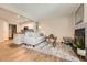 Inviting living room with open layout, fireplace, and access to the kitchen and dining area at 13704 E Lehigh Ave # D, Aurora, CO 80014