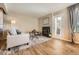 Comfortable living room with fireplace, neutral tones, and hardwood floors at 13704 E Lehigh Ave # D, Aurora, CO 80014