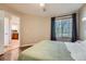 Bright main bedroom with window and access to the kitchen at 13704 E Lehigh Ave # D, Aurora, CO 80014