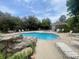 Community pool with lounge chairs, tables and a spa perfect for relaxing or swimming laps at 13704 E Lehigh Ave # D, Aurora, CO 80014