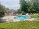 Community pool with lounge chairs, tables and a spa perfect for relaxing or swimming laps at 13704 E Lehigh Ave # D, Aurora, CO 80014