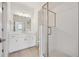 Bright bathroom with a white vanity and large glass shower at 1261 Penner Dr, Erie, CO 80026