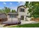 Inviting backyard featuring a deck, patio, manicured lawn and mature trees at 9737 Canberra Ct, Highlands Ranch, CO 80130