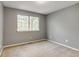 Bedroom with neutral carpet, gray paint, and a bright window at 9737 Canberra Ct, Highlands Ranch, CO 80130