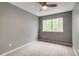 Bedroom with neutral carpet, gray paint, and a bright window at 9737 Canberra Ct, Highlands Ranch, CO 80130