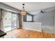 An open dining area featuring sliding glass doors and hardwood floors at 9737 Canberra Ct, Highlands Ranch, CO 80130