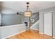 Bright living area with a fireplace, hardwood floors, and staircase at 9737 Canberra Ct, Highlands Ranch, CO 80130