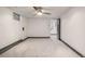 Finished basement room with neutral carpeting and ceiling fan at 6490 E Dakota Ave, Denver, CO 80224
