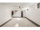 Spacious finished basement with neutral carpeting and ceiling fan at 6490 E Dakota Ave, Denver, CO 80224