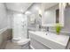 Modern bathroom with single vanity and curved shower at 6490 E Dakota Ave, Denver, CO 80224