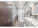 Clean bathroom with a walk-in shower and single vanity at 6490 E Dakota Ave, Denver, CO 80224