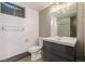 Basement bathroom with updated vanity and shower/tub combo at 6490 E Dakota Ave, Denver, CO 80224