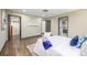 Bright bedroom with hardwood floors and ensuite bathroom at 6490 E Dakota Ave, Denver, CO 80224
