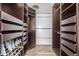 Large walk-in closet with custom shelving and drawers at 6490 E Dakota Ave, Denver, CO 80224