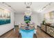 Elegant dining room, hardwood floors, modern chandelier at 6490 E Dakota Ave, Denver, CO 80224