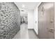 Bright entryway with modern tile and kitchen view at 6490 E Dakota Ave, Denver, CO 80224