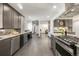 Modern kitchen with stainless steel appliances and an island at 6490 E Dakota Ave, Denver, CO 80224