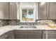 Modern kitchen with granite countertops and stainless steel appliances at 6490 E Dakota Ave, Denver, CO 80224