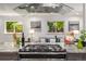 Modern kitchen with stainless steel range and hood, plus stylish decor and view to living space at 6490 E Dakota Ave, Denver, CO 80224