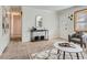 Bright living room with new carpet, tiled entryway and neutral wall colors at 3359 W Layton Ave, Englewood, CO 80110