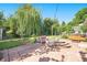 Beautiful backyard with a large stone patio, comfortable seating, and a relaxing hot tub at 6248 W 75Th, Arvada, CO 80003