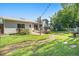 Expansive backyard with a patio, hot tub, lush lawn, and a charming garden area at 6248 W 75Th, Arvada, CO 80003