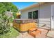 Inviting outdoor hot tub with easy access steps and adjacent to the home's exterior at 6248 W 75Th, Arvada, CO 80003