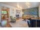 Spacious living room showcasing open layout, modern lighting, stylish furniture, and hardwood floors at 6248 W 75Th, Arvada, CO 80003